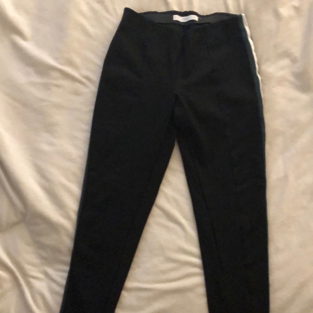 Black leggings with stripes on the side. Size M